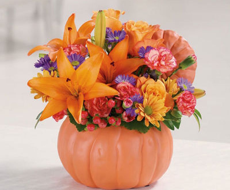 Beautiful floral creation along with some pumpkins