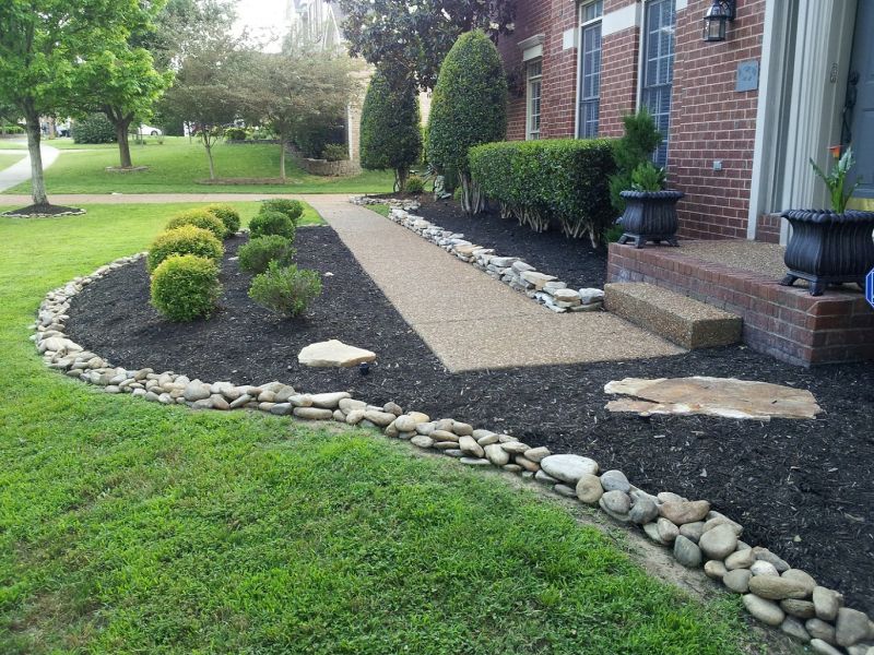 river rocks to edge the garden