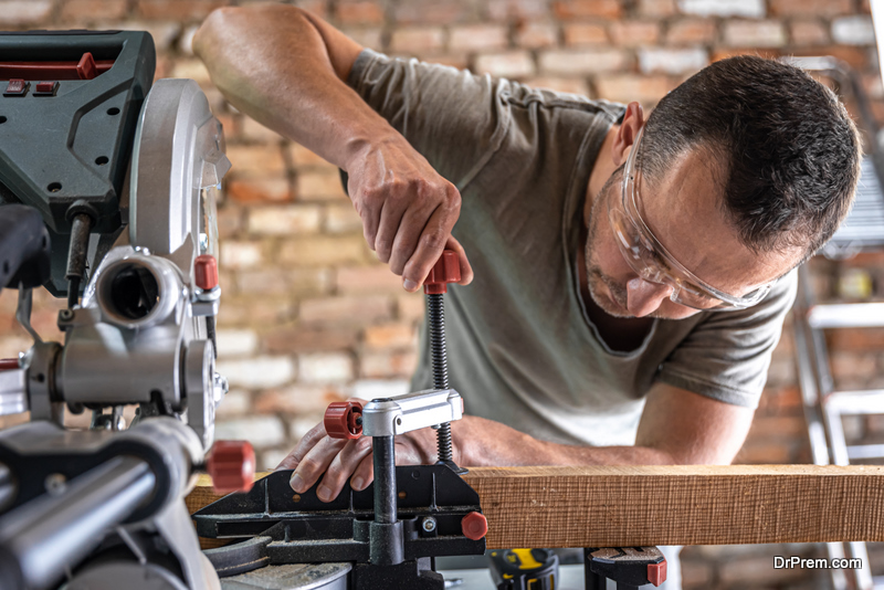 man using Miter Saw 