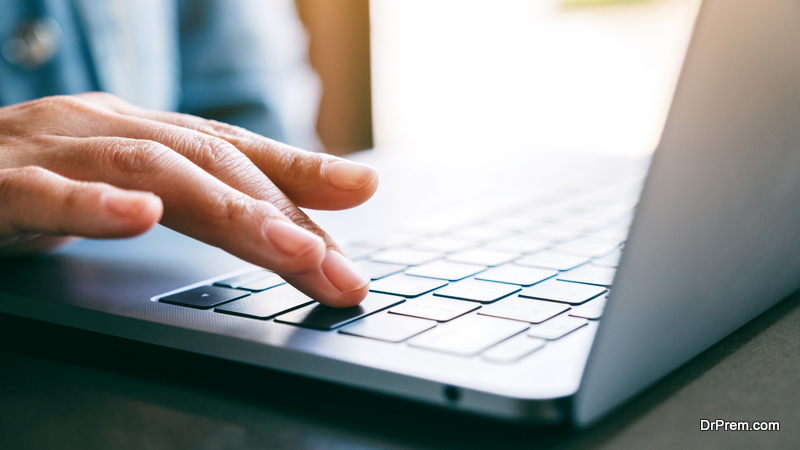 woman's finger pressing on the enter button