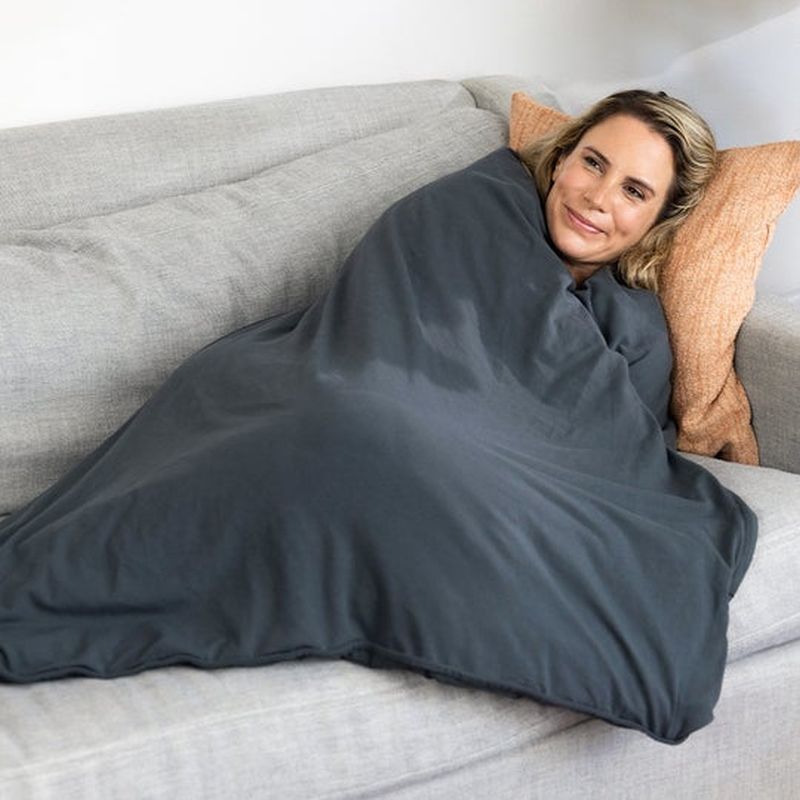 calm woman in a weighted blanket
