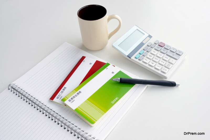  passbook and calculator on table